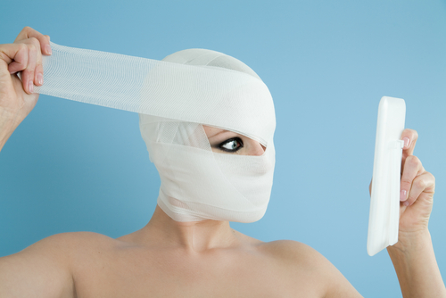 Plastic surgery concept on blue background.-img-blog